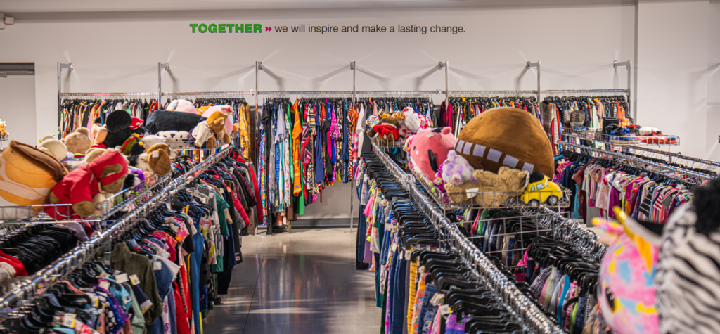 Inside Goodwill store with clothing and household items